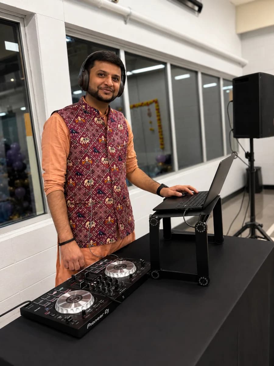 DJ H3T performing in traditional Gujarati attire at a baby shower